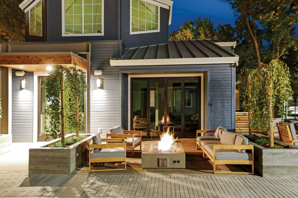 Outdoor seating around ignited fire pit in the evening